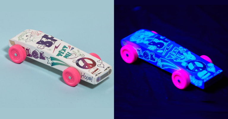 Next big thing in Pinewood Derby racing: black lights and glow-in-the-dark cars